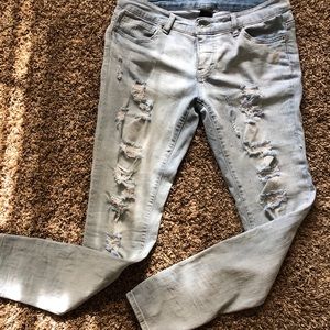 Distressed faded jeans